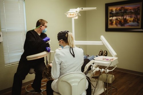 dentist performing cosmetic dentistry